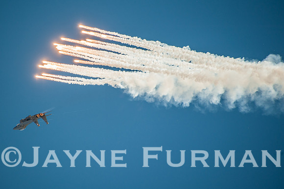 F-15 Eagle performing combat evasive movement with flairs