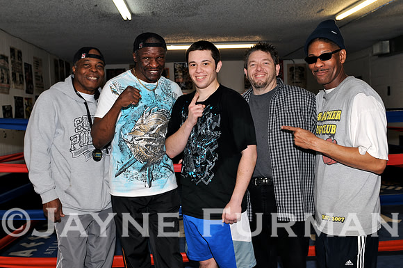 Taylor with his dad Greg, and trainers